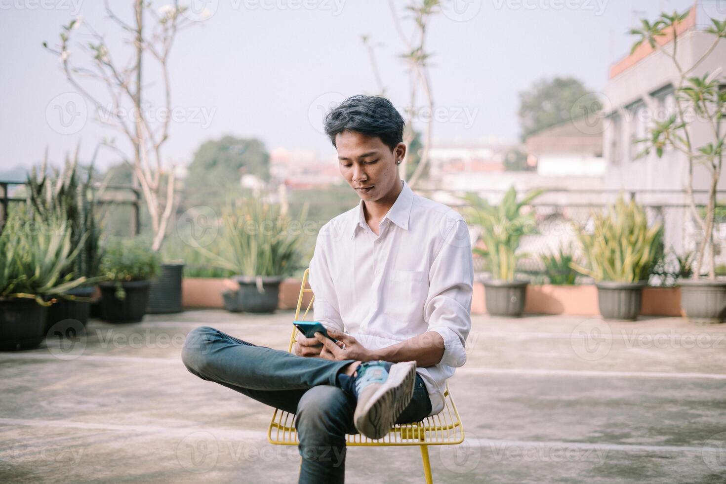 A person with a baffled expression, looking at something confusing on their phone photo