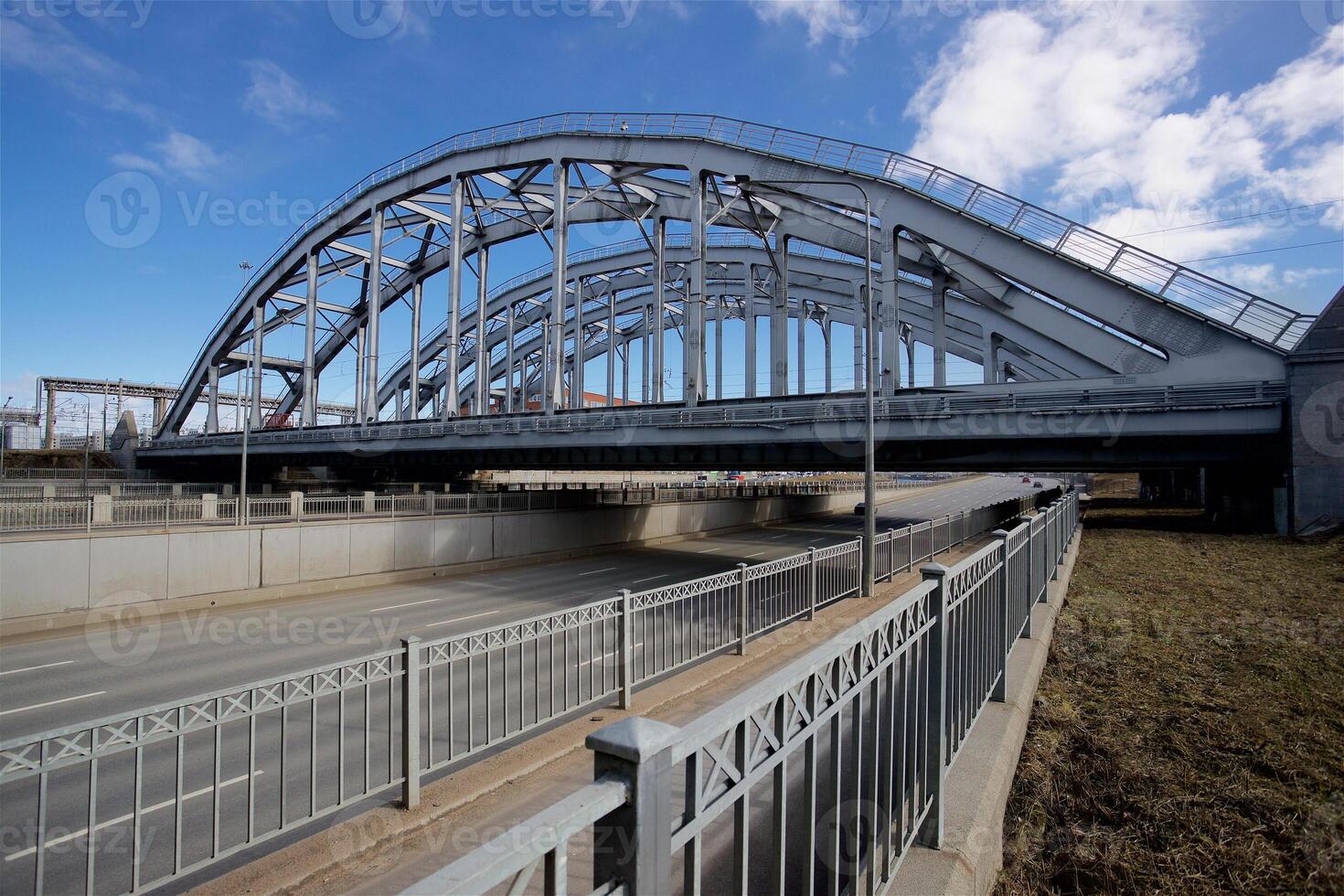 Railway bridge over the highway in the city of St. Petersburg, Russia. American Bridge photo