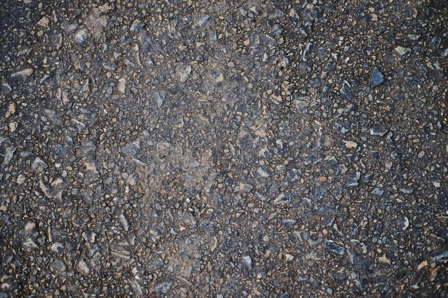 Concrete road have a rough surface. Gravel craggy texture and background photo