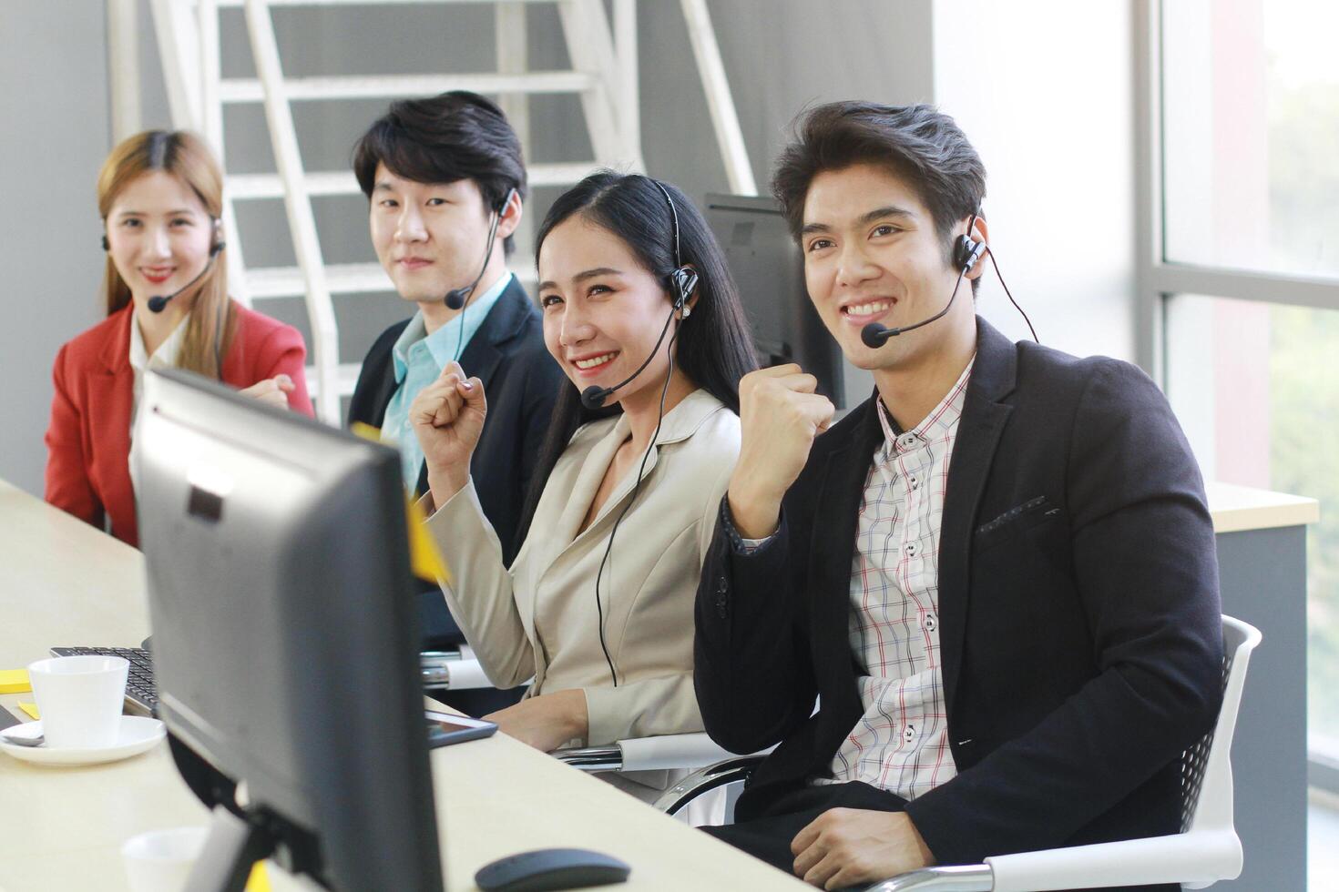 Powerful and Sucessful of Business group Call Center and technical Support staff for receptionist phone operator. Asian customer support team. photo