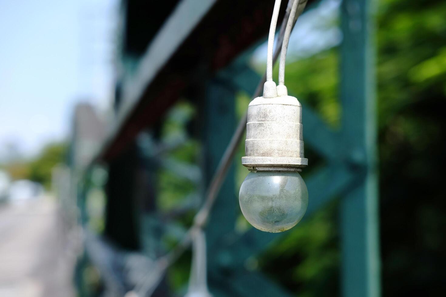 Equipped and electrical with light bulbs is hanging in the wind and sunlight decorated for outdoor of cafe and vintage house building photo