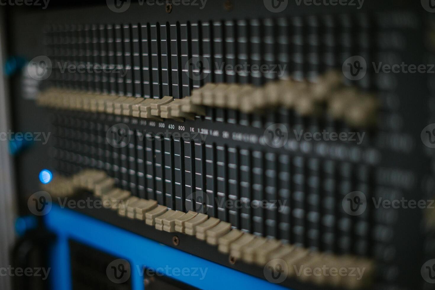 An audio mixer with its knobs and sliders meticulously adjusted, embodying precision and control in the art of sound engineering and music production photo