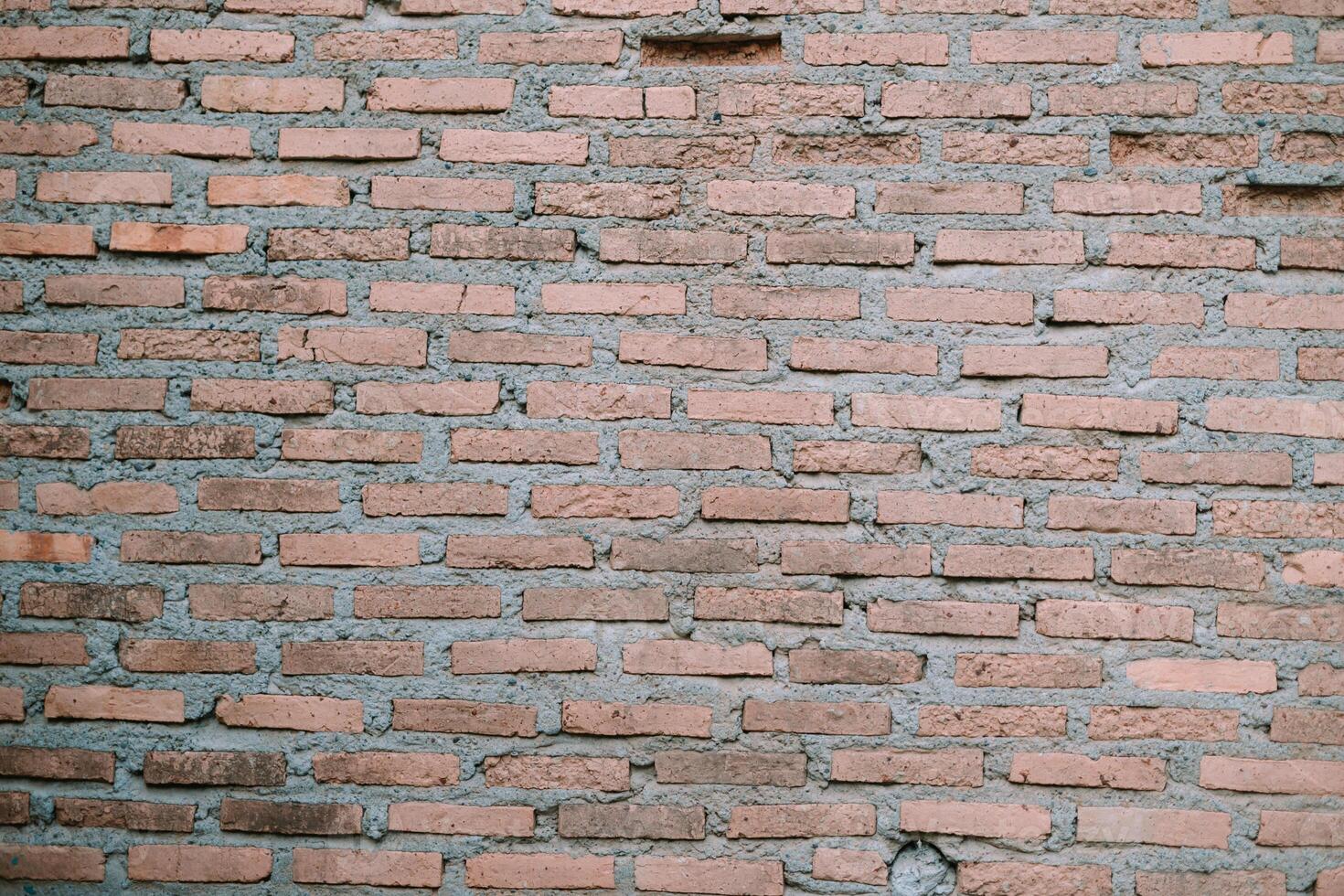 A striking red brick wall, showcasing rustic charm and timeless elegance, adding character to any architectural composition photo