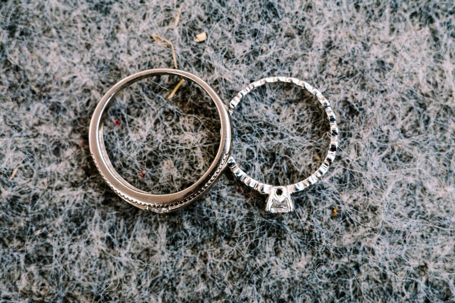A gleaming wedding ring delicately placed on a black velvet cushion, symbolizing eternal love and commitment in a timeless moment photo