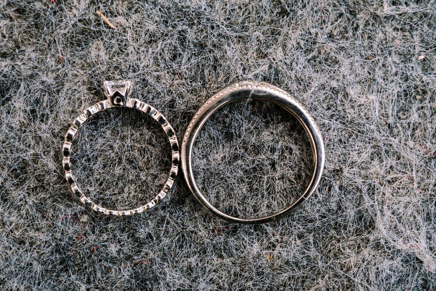 A gleaming wedding ring delicately placed on a black velvet cushion, symbolizing eternal love and commitment in a timeless moment photo