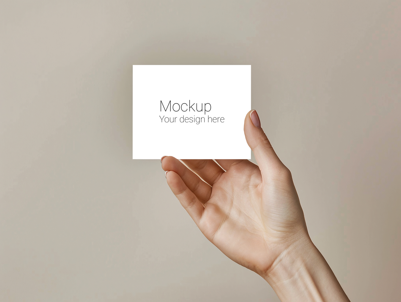 Mockup of greeting card in hand on beige background psd
