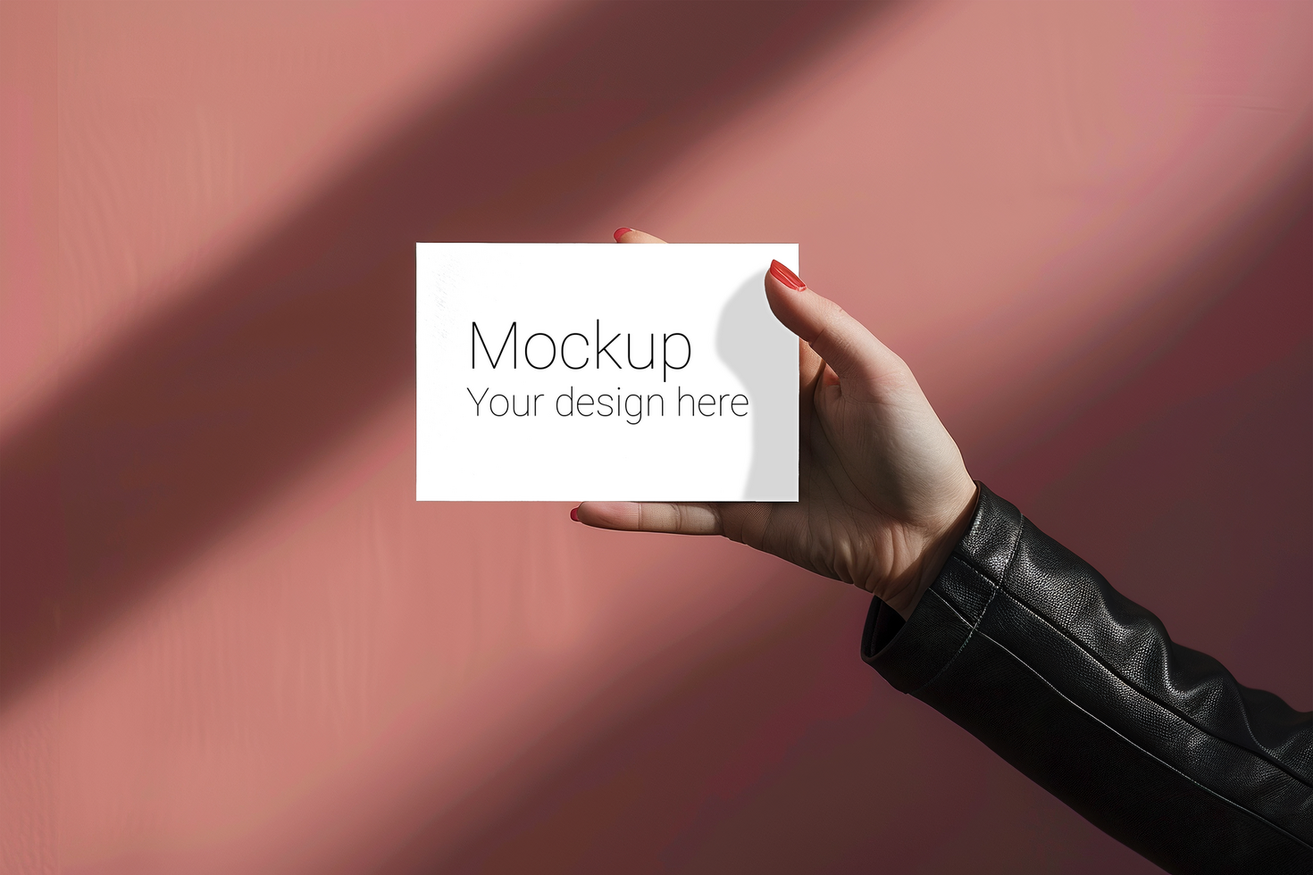 Mockup of greeting card in hand on pink background psd