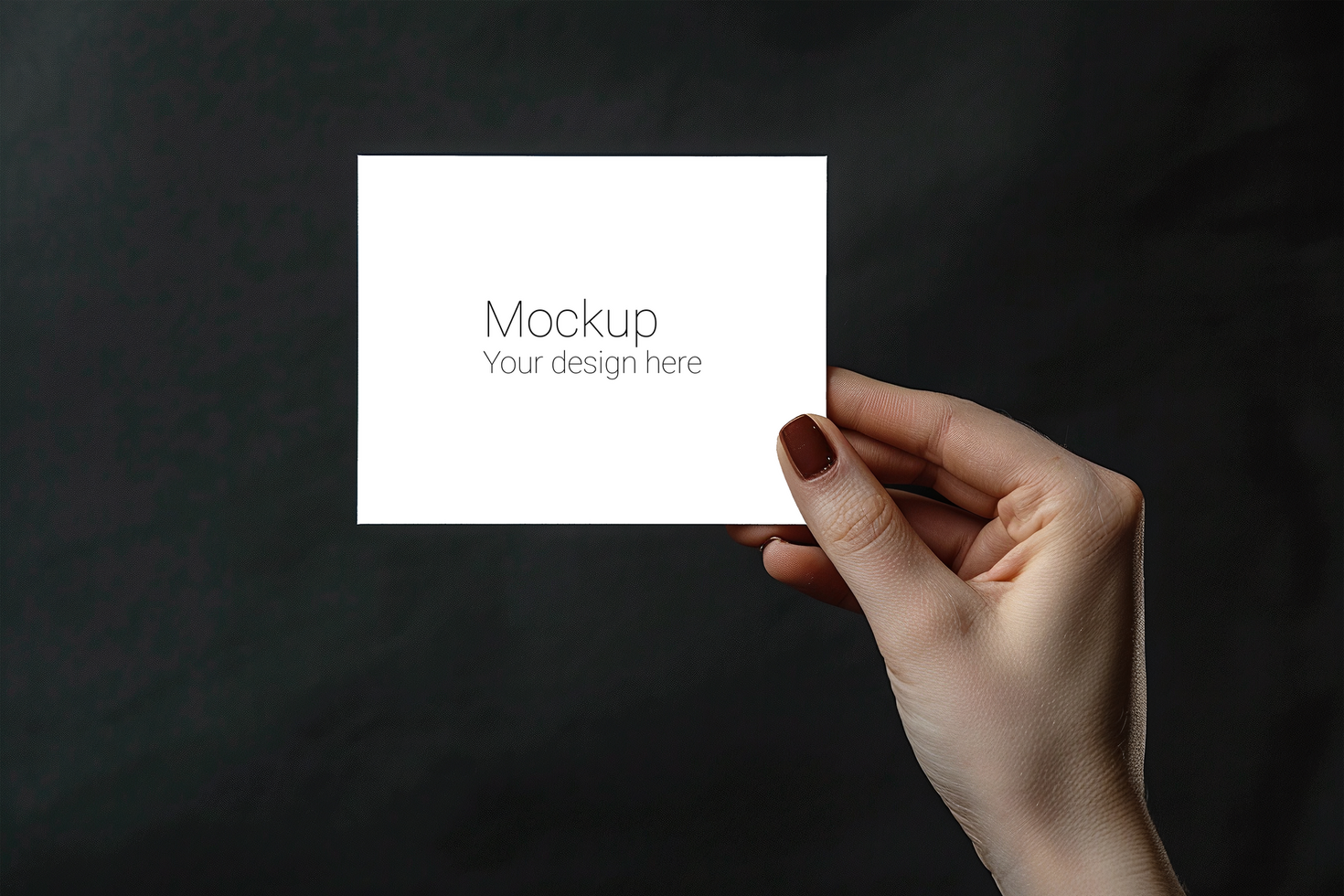 Mockup of greeting card in hand on black background psd