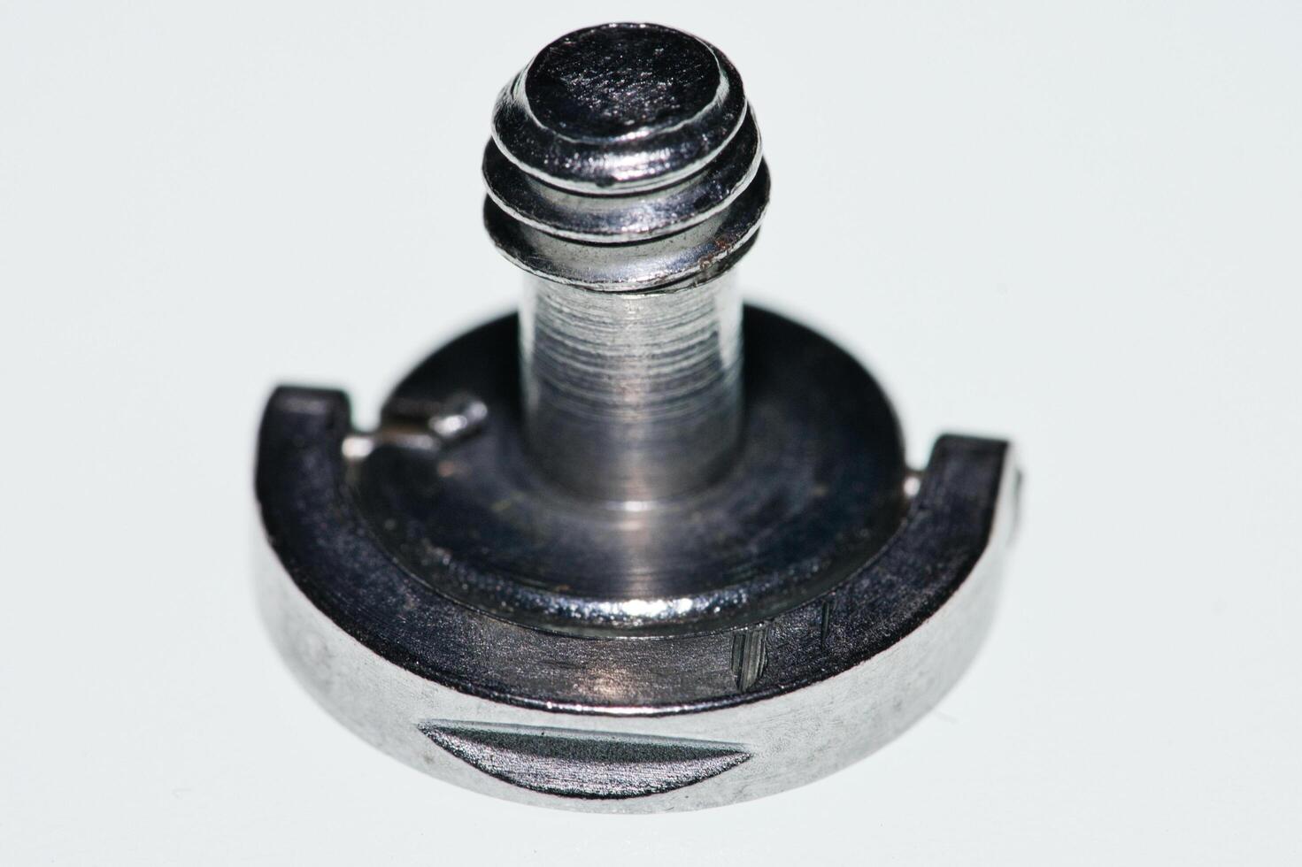 a screw on a white surface photo