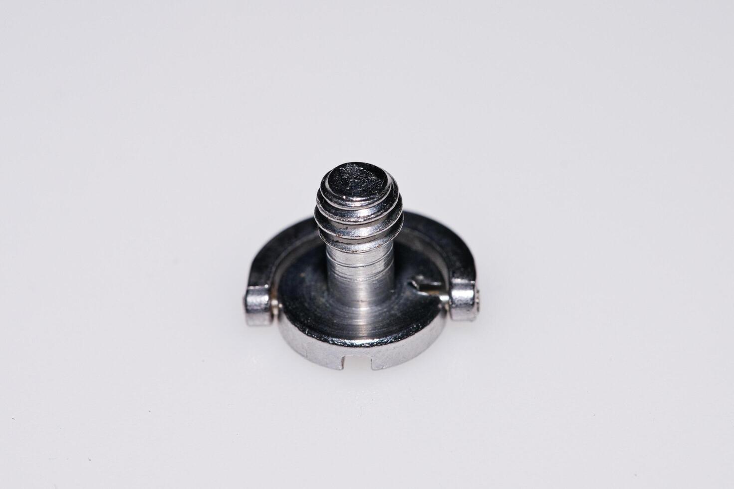a screw on a white surface photo