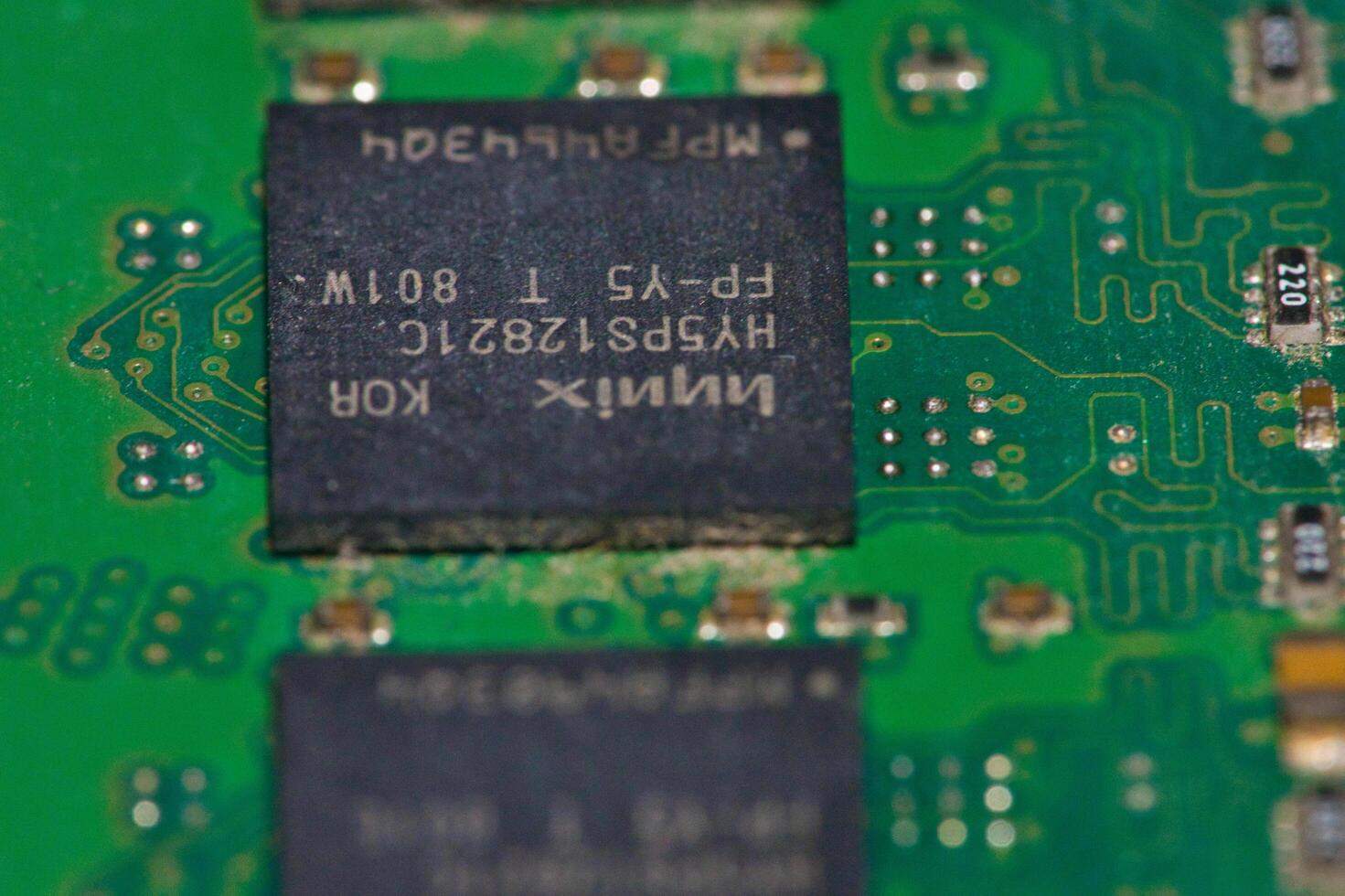 a close up of a green electronic circuit board photo