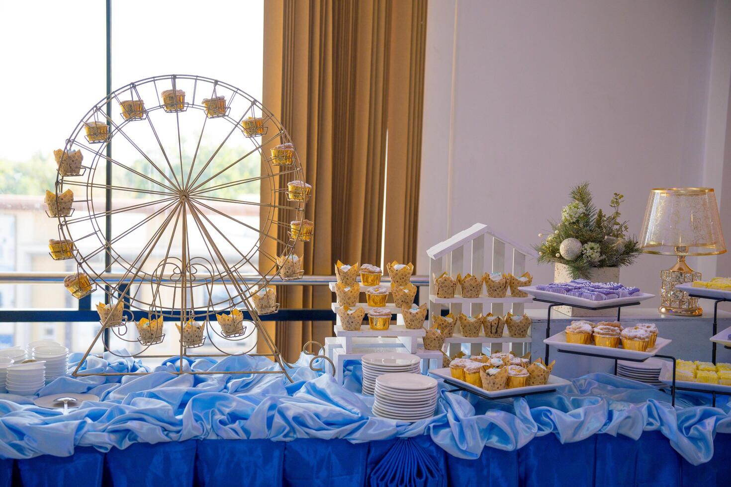 a table with a ferris wheel and a lot of food photo