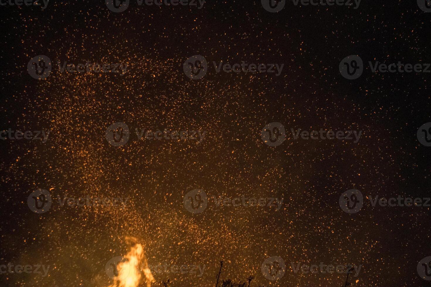 Fire embers particles over black background. Fire sparks background. Czech photo