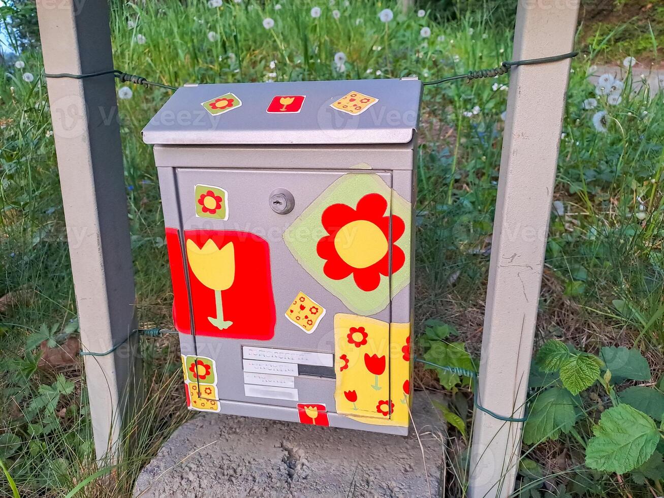 Fun artistic mail box with painted flowers. Colorful antique mailboxes. Czech photo