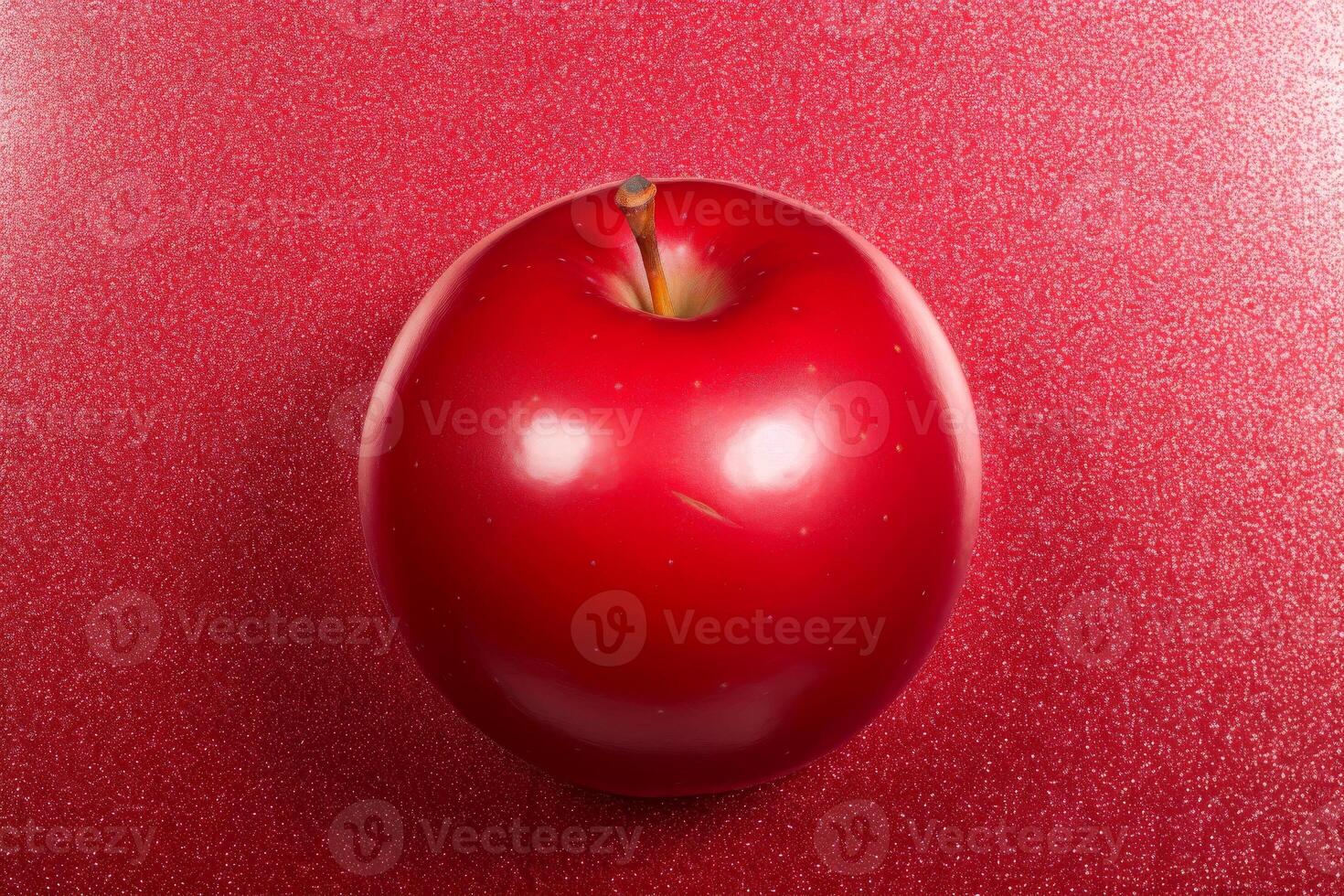 Vibrant red apple sits against matching glittery red background, The apple glossy surface reflects light, photo