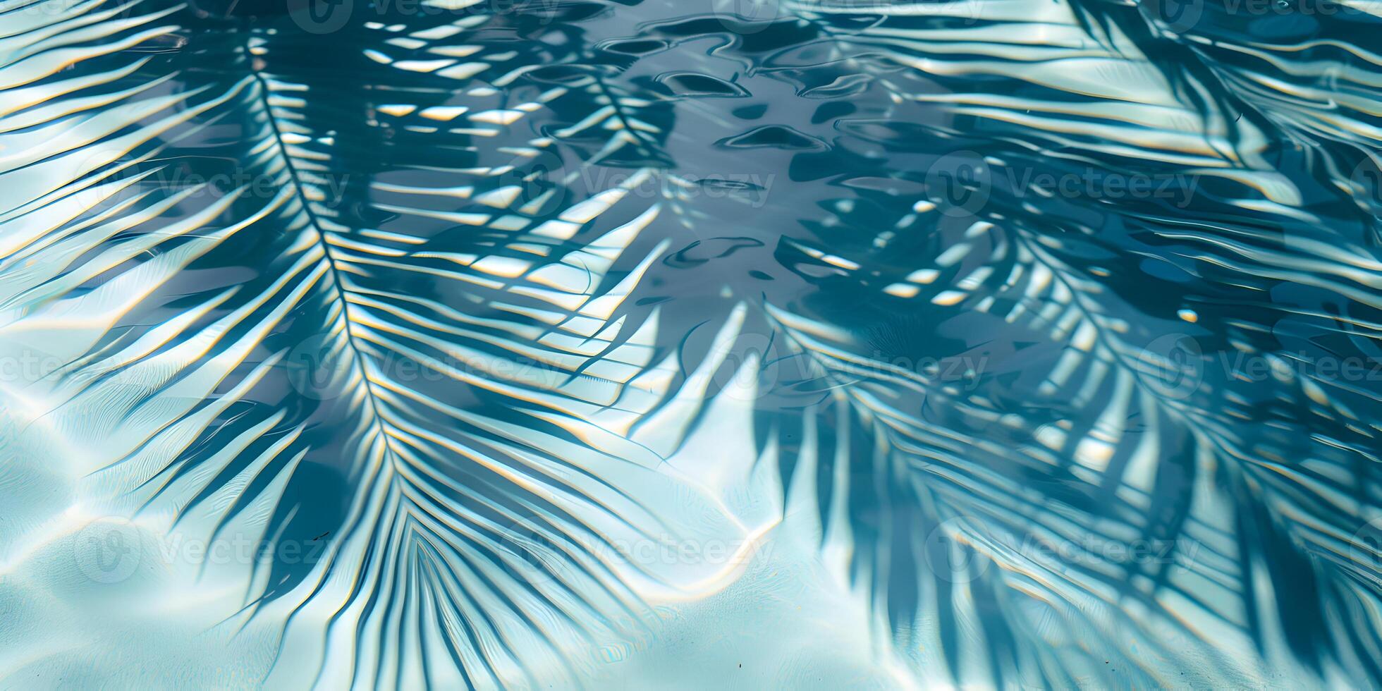 Tropical palm leaves shadow on blue water surface in swimming pool. Summer vacation at the beach, recreation, tourism and sea travel concept. Beautiful abstract background with copy space. photo