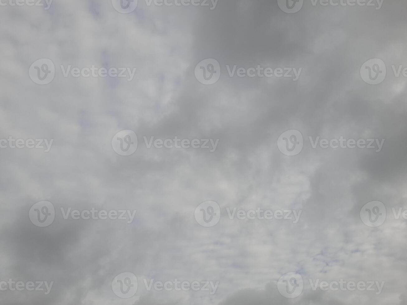 Beautiful grey clouds on sky background. Large bright soft fluffy clouds are cover the entire sky. photo