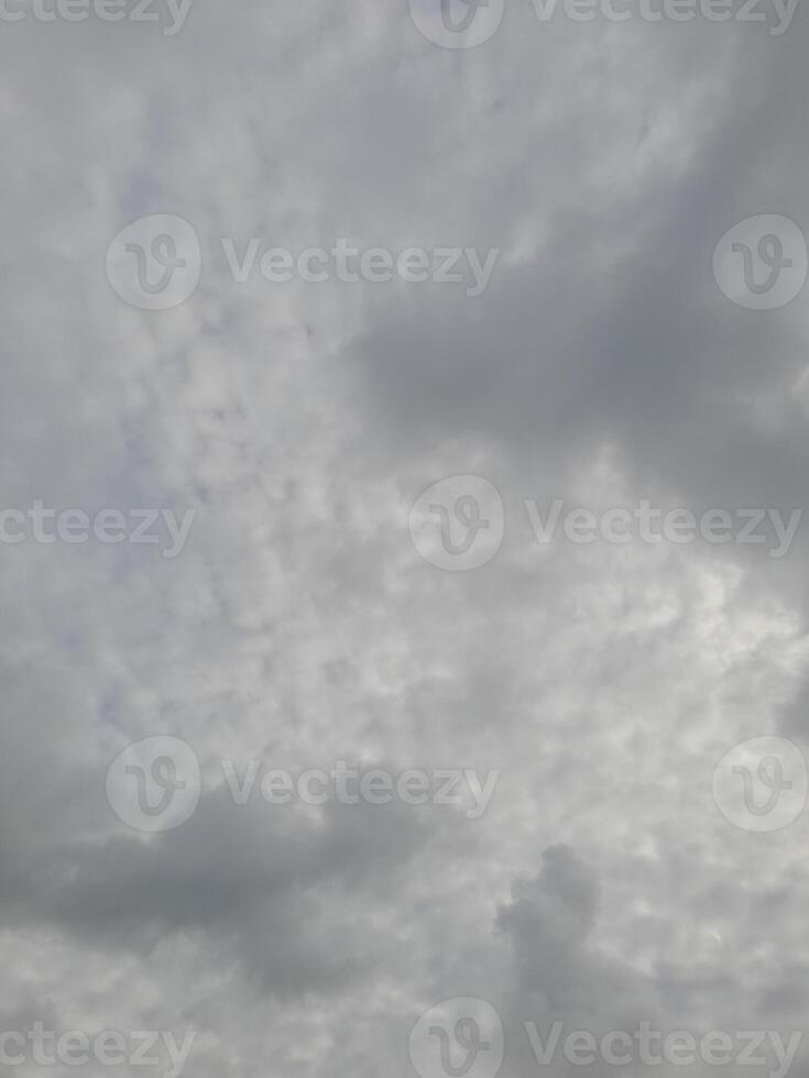 Beautiful grey clouds on sky background. Large bright soft fluffy clouds are cover the entire sky. photo