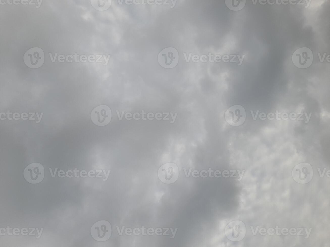 Beautiful grey clouds on sky background. Large bright soft fluffy clouds are cover the entire sky. photo
