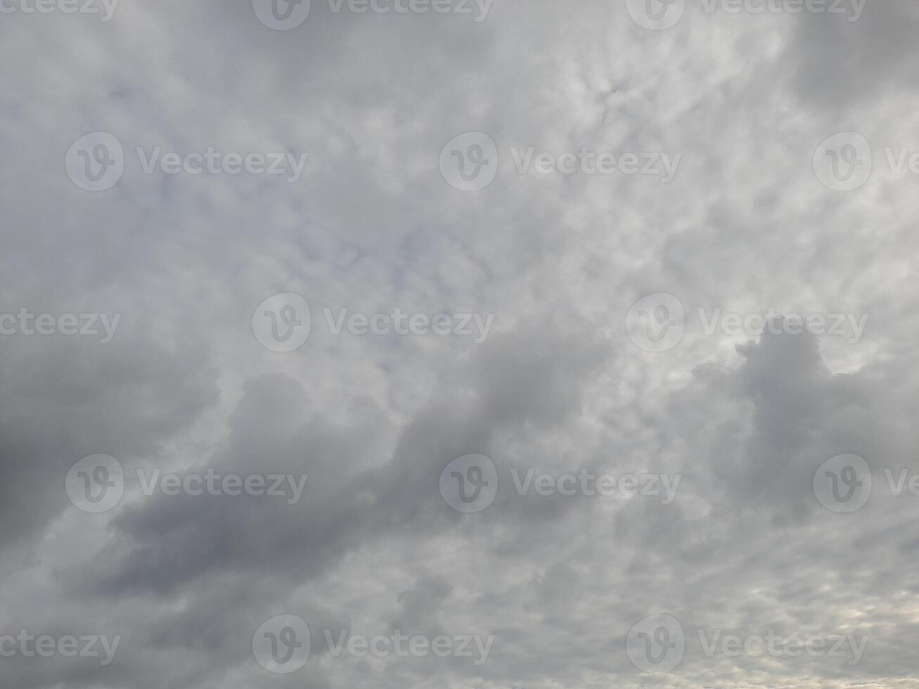 Beautiful grey clouds on sky background. Large bright soft fluffy clouds are cover the entire sky. photo