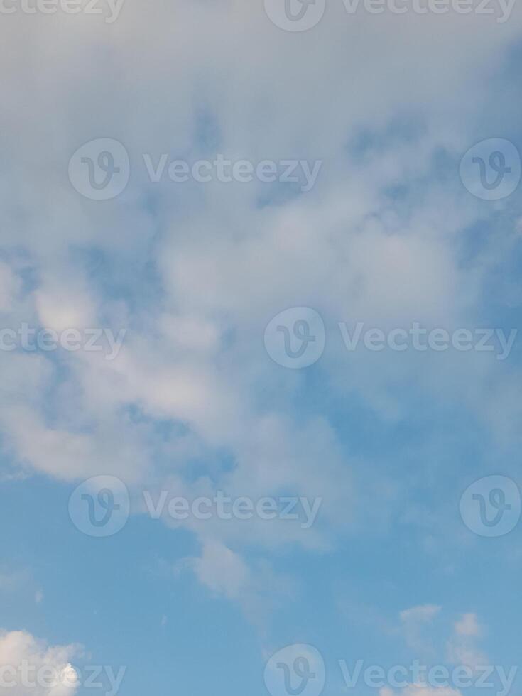 Beautiful white clouds on deep blue sky background. Large bright soft fluffy clouds are cover the entire blue sky. photo