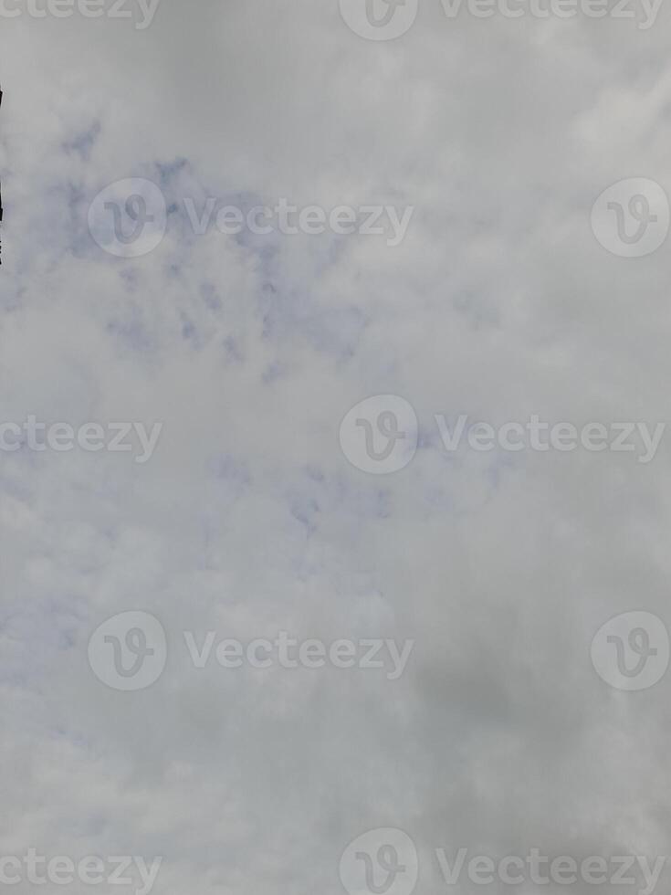 Beautiful grey clouds on sky background. Large bright soft fluffy clouds are cover the entire sky. photo