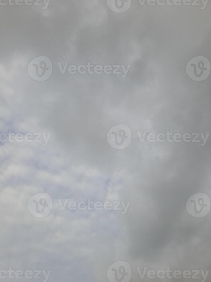 Beautiful grey clouds on sky background. Large bright soft fluffy clouds are cover the entire sky. photo