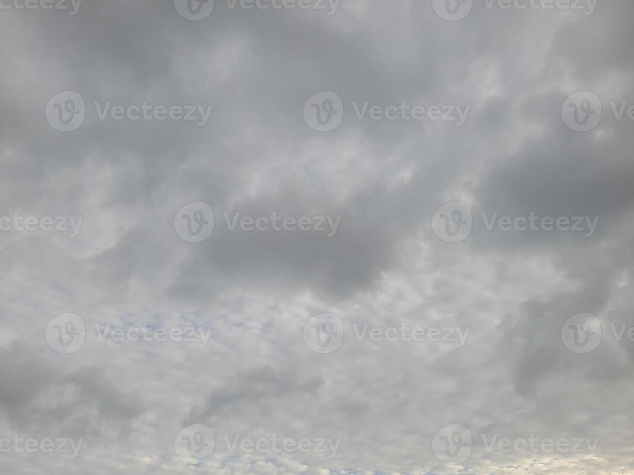 Beautiful grey clouds on sky background. Large bright soft fluffy clouds are cover the entire sky. photo