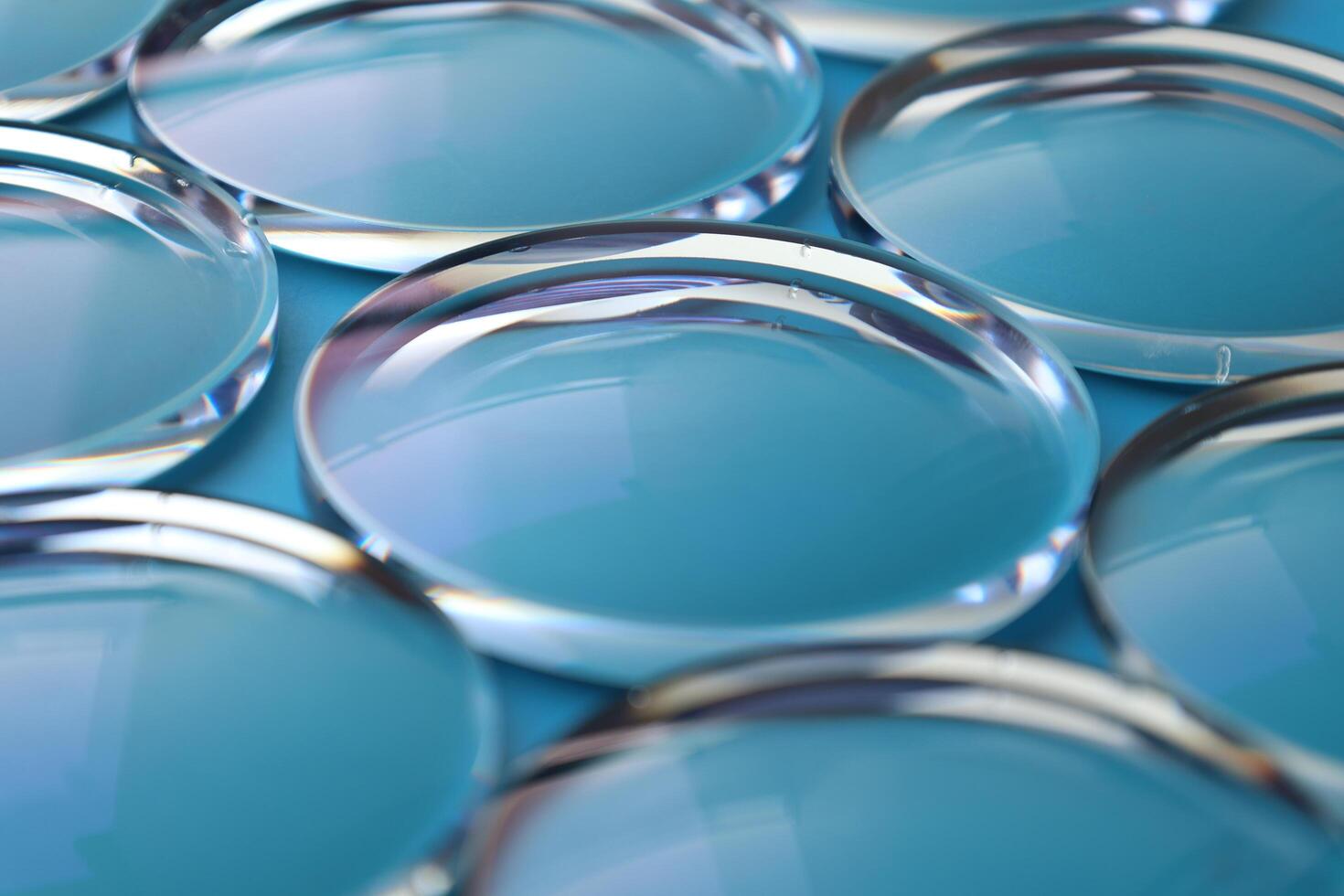 Eyeglasses lens production industry, close-up eyeglasses lenses, eyeglasses lenses, eyeglasses lenses, eyeglasses store business concept photo