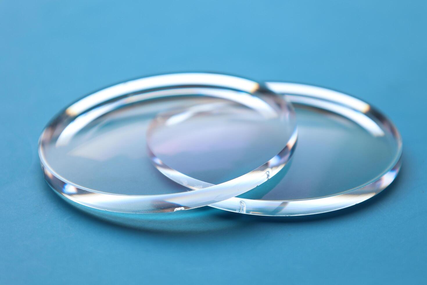 Eyeglasses lens production industry, close-up eyeglasses lenses, eyeglasses lenses, eyeglasses lenses, eyeglasses store business concept photo