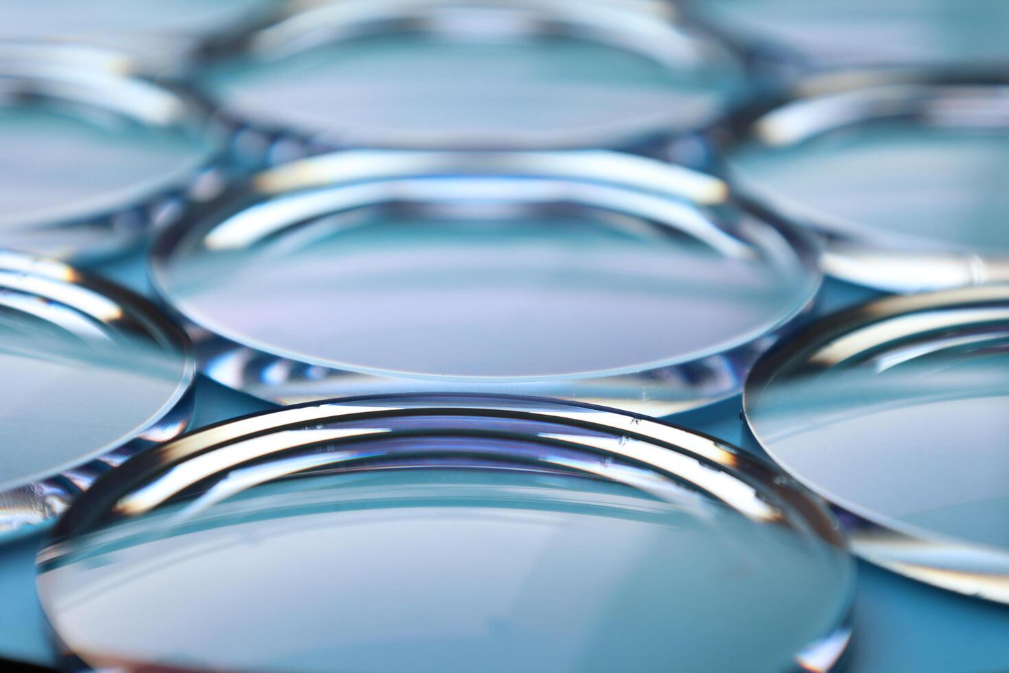 Eyeglasses lens production industry, close-up eyeglasses lenses, eyeglasses lenses, eyeglasses lenses, eyeglasses store business concept photo