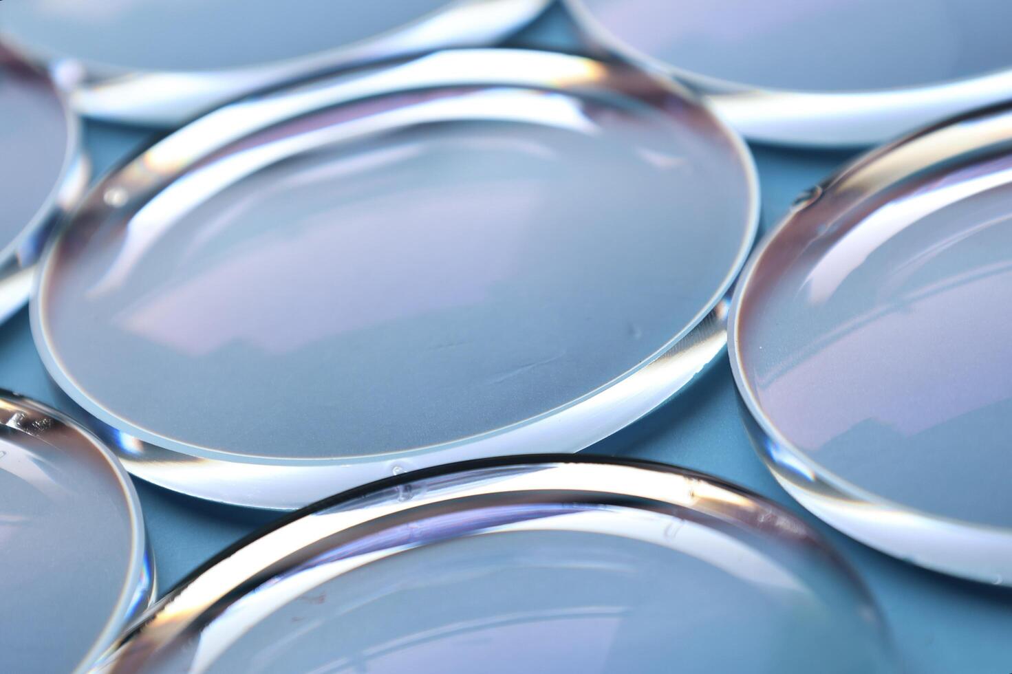 Eyeglasses lens production industry, close-up eyeglasses lenses, eyeglasses lenses, eyeglasses lenses, eyeglasses store business concept photo