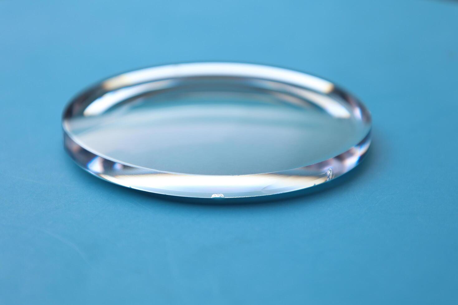 Eyeglasses lens production industry, close-up eyeglasses lenses, eyeglasses lenses, eyeglasses lenses, eyeglasses store business concept photo