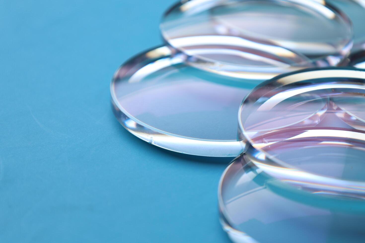 Eyeglasses lens production industry, close-up eyeglasses lenses, eyeglasses lenses, eyeglasses lenses, eyeglasses store business concept photo