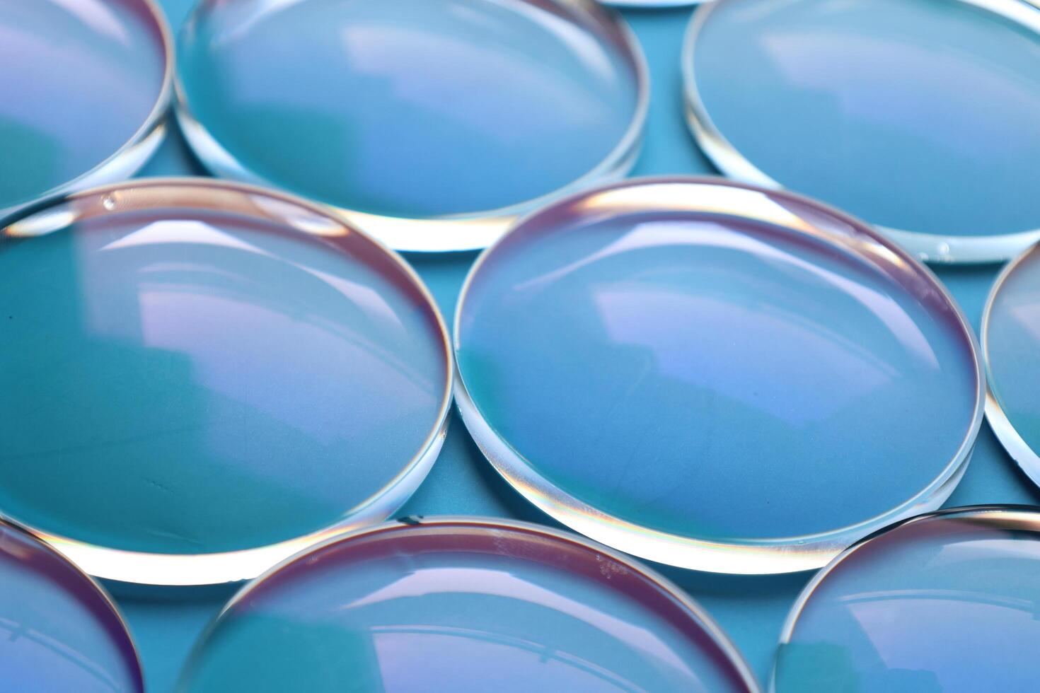 Eyeglasses lens production industry, close-up eyeglasses lenses, eyeglasses lenses, eyeglasses lenses, eyeglasses store business concept photo