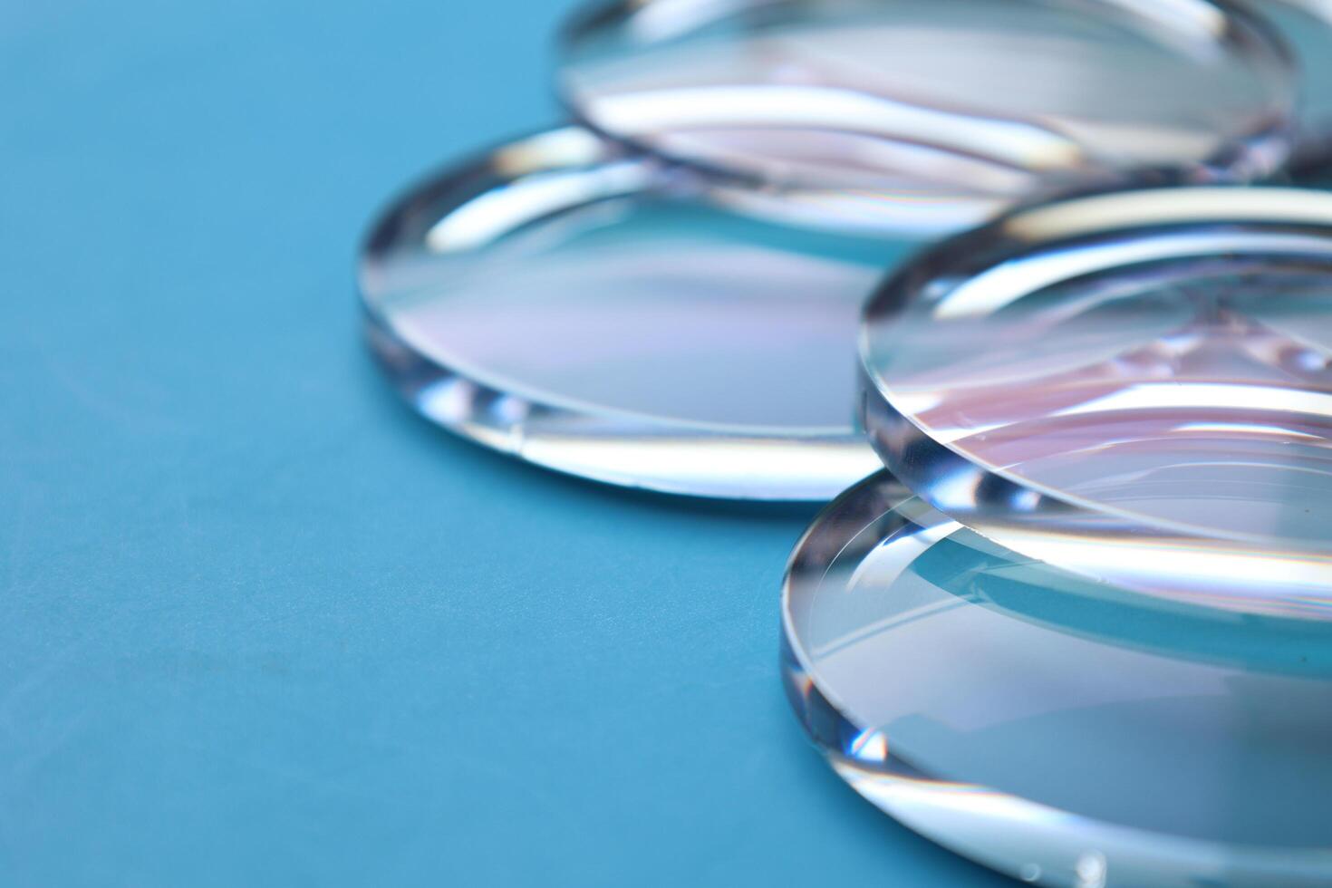 Eyeglasses lens production industry, close-up eyeglasses lenses, eyeglasses lenses, eyeglasses lenses, eyeglasses store business concept photo