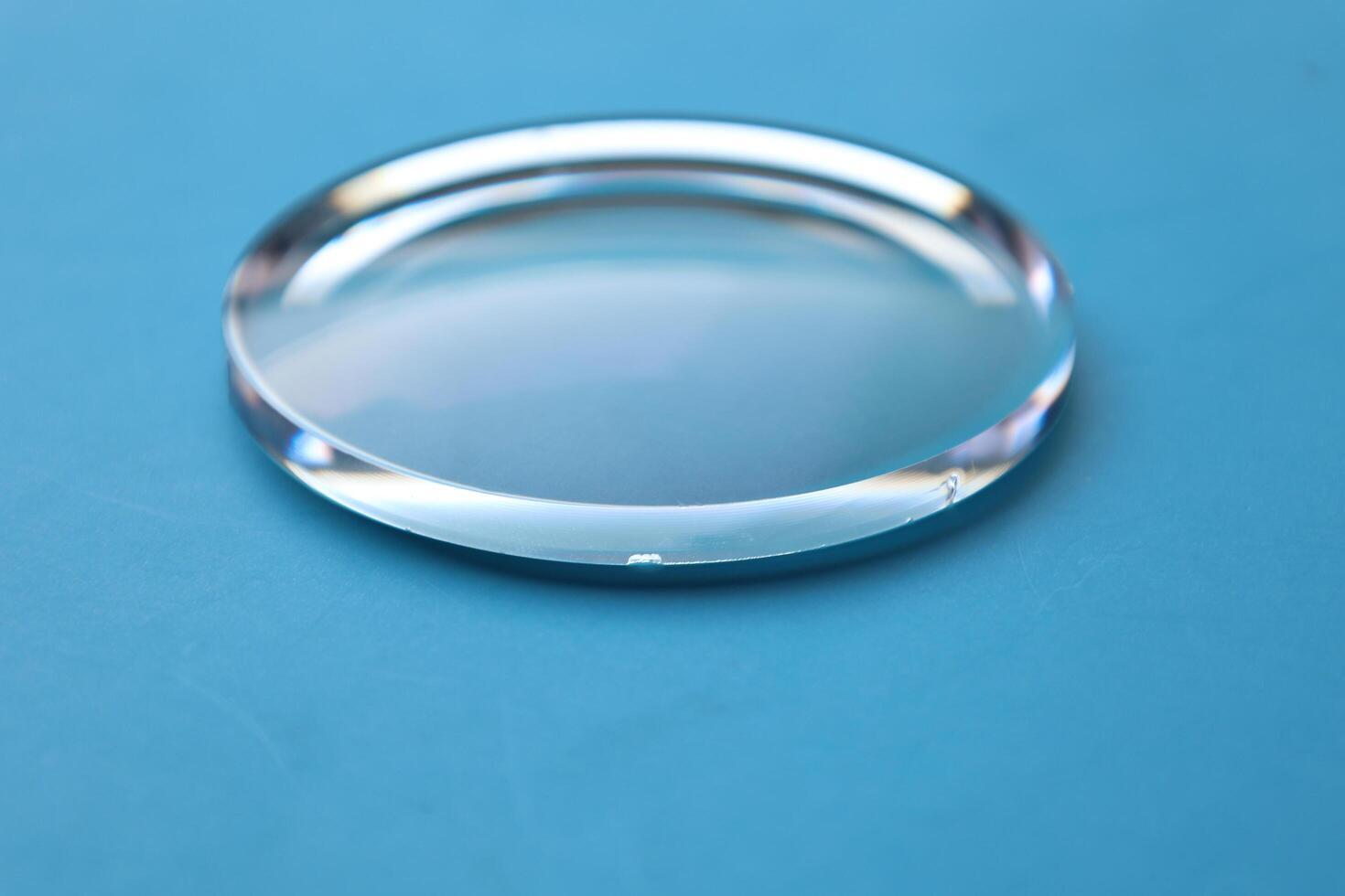 Eyeglasses lens production industry, close-up eyeglasses lenses, eyeglasses lenses, eyeglasses lenses, eyeglasses store business concept photo
