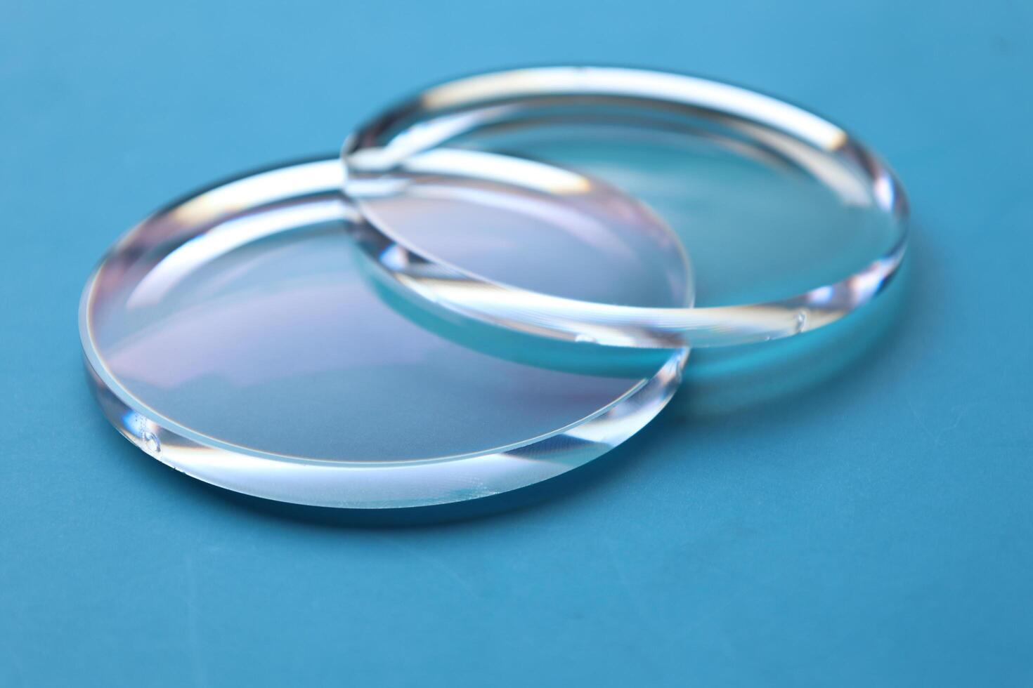 Eyeglasses lens production industry, close-up eyeglasses lenses, eyeglasses lenses, eyeglasses lenses, eyeglasses store business concept photo