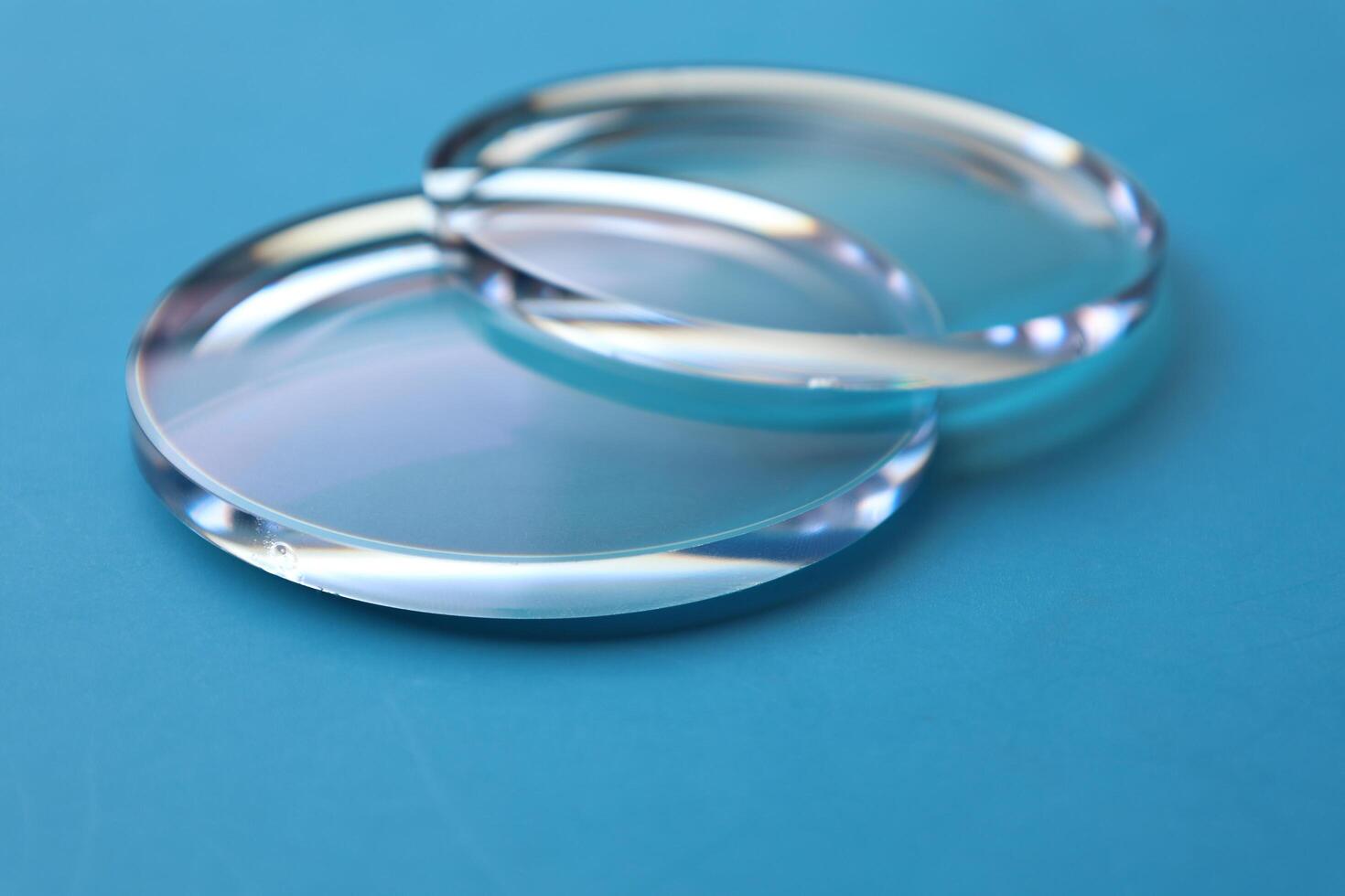 Eyeglasses lens production industry, close-up eyeglasses lenses, eyeglasses lenses, eyeglasses lenses, eyeglasses store business concept photo