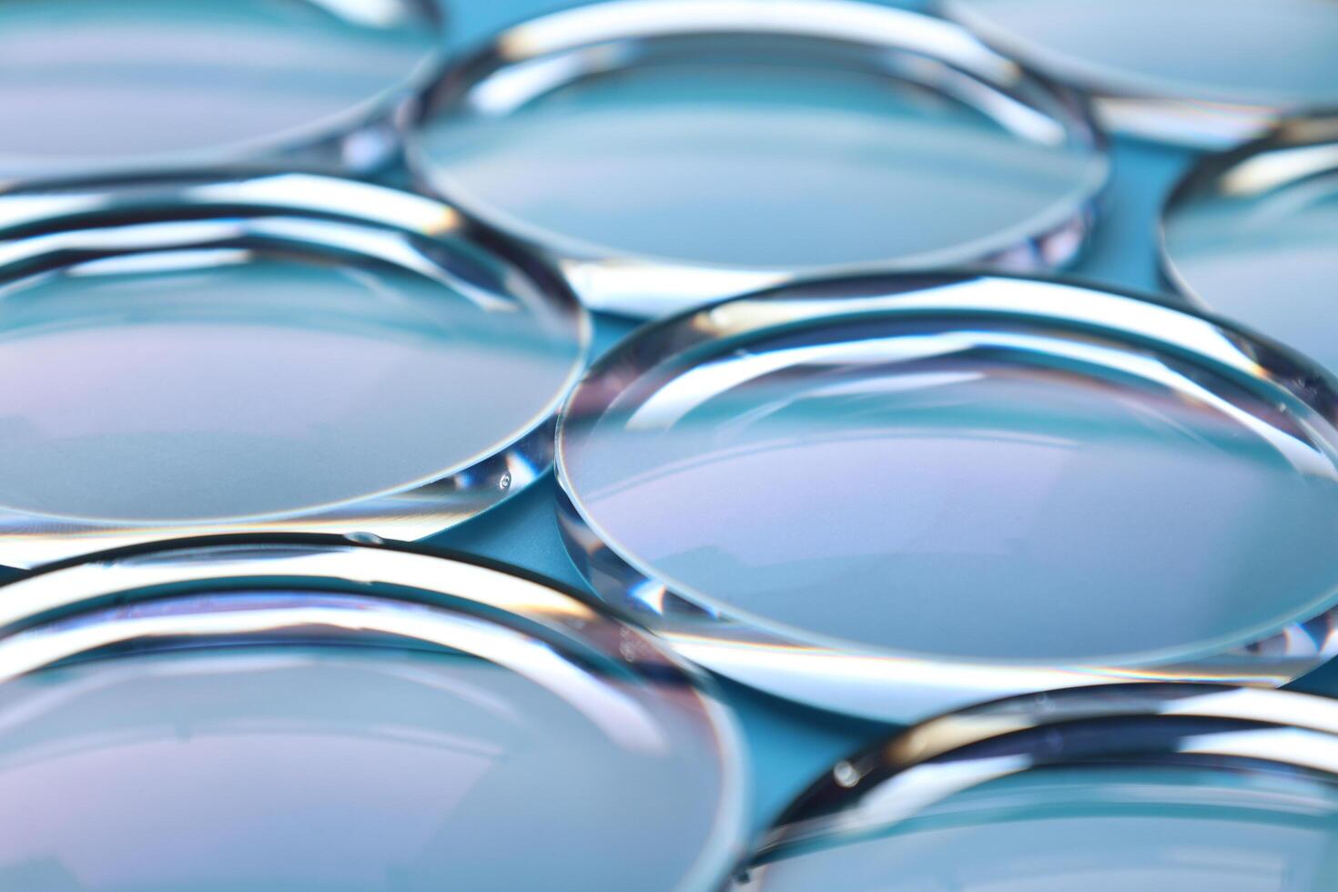 Eyeglasses lens production industry, close-up eyeglasses lenses, eyeglasses lenses, eyeglasses lenses, eyeglasses store business concept photo