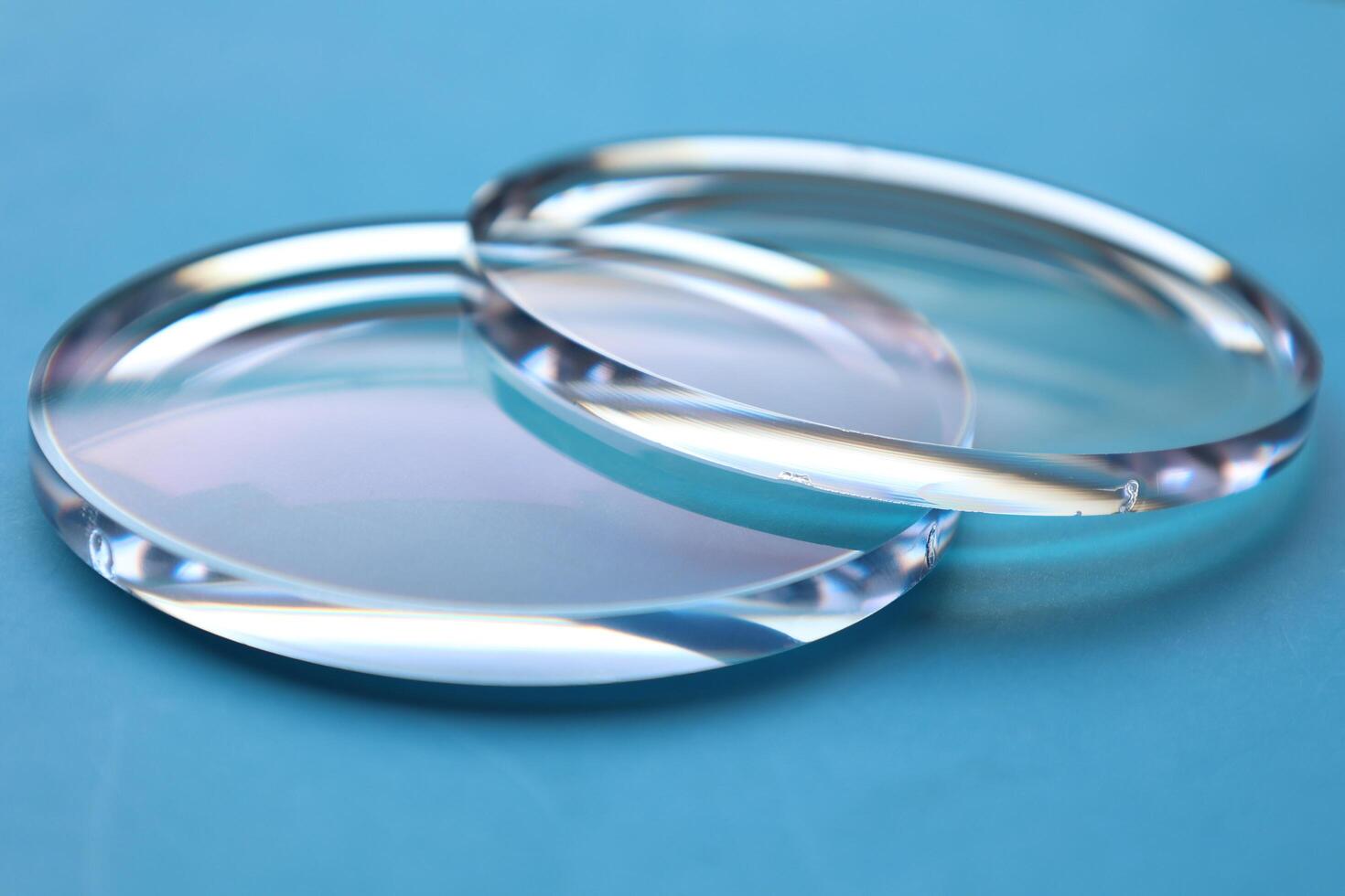 Eyeglasses lens production industry, close-up eyeglasses lenses, eyeglasses lenses, eyeglasses lenses, eyeglasses store business concept photo