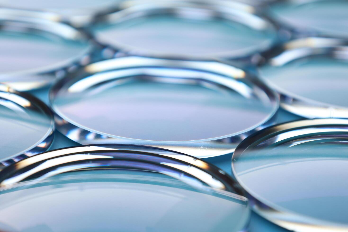 Eyeglasses lens production industry, close-up eyeglasses lenses, eyeglasses lenses, eyeglasses lenses, eyeglasses store business concept photo