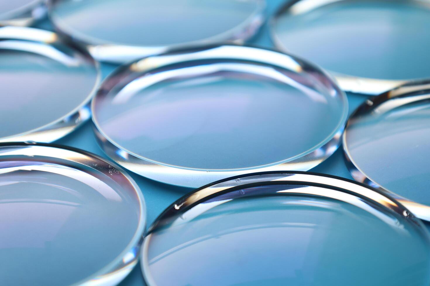 Eyeglasses lens production industry, close-up eyeglasses lenses, eyeglasses lenses, eyeglasses lenses, eyeglasses store business concept photo
