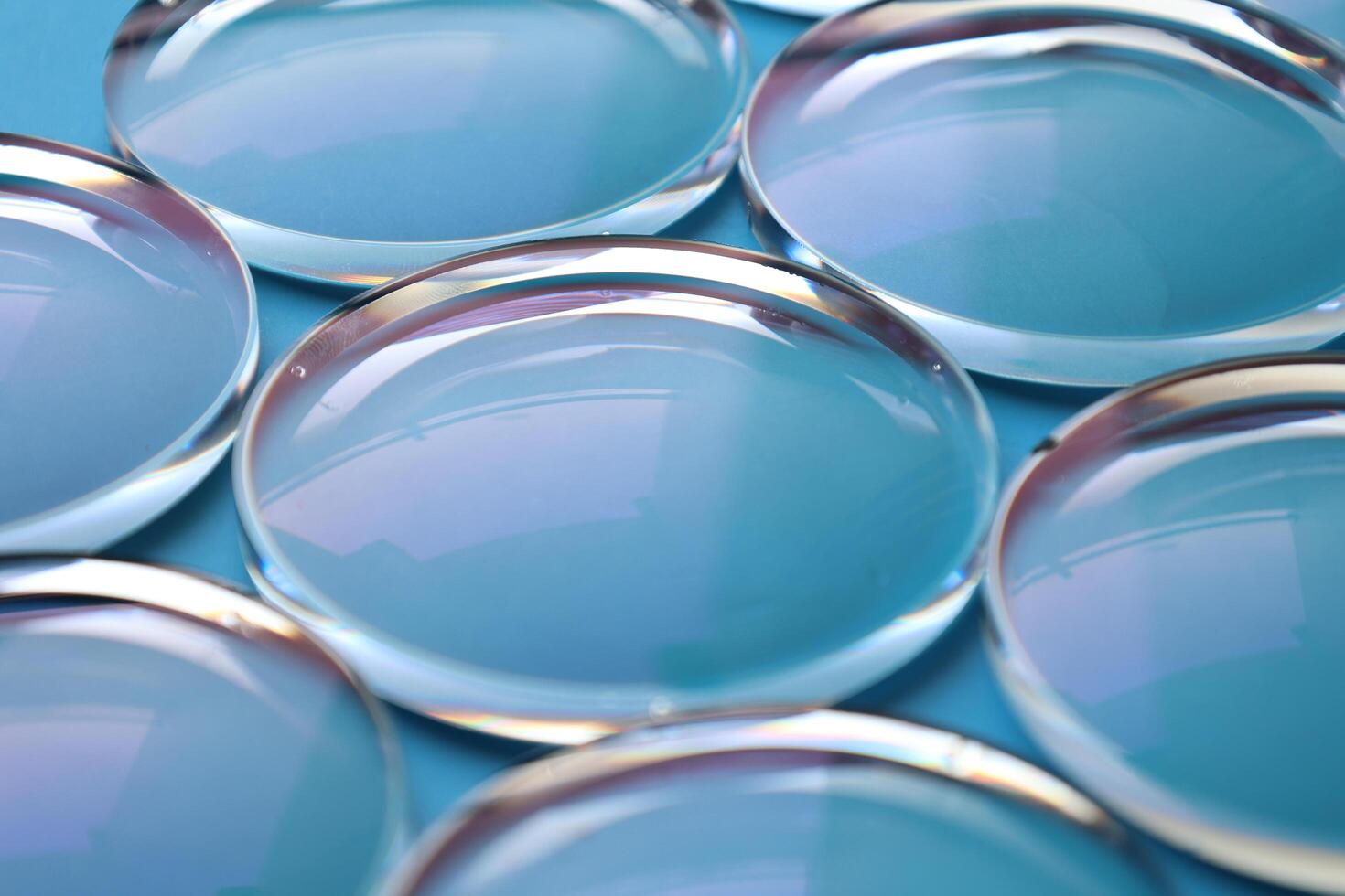 Eyeglasses lens production industry, close-up eyeglasses lenses, eyeglasses lenses, eyeglasses lenses, eyeglasses store business concept photo