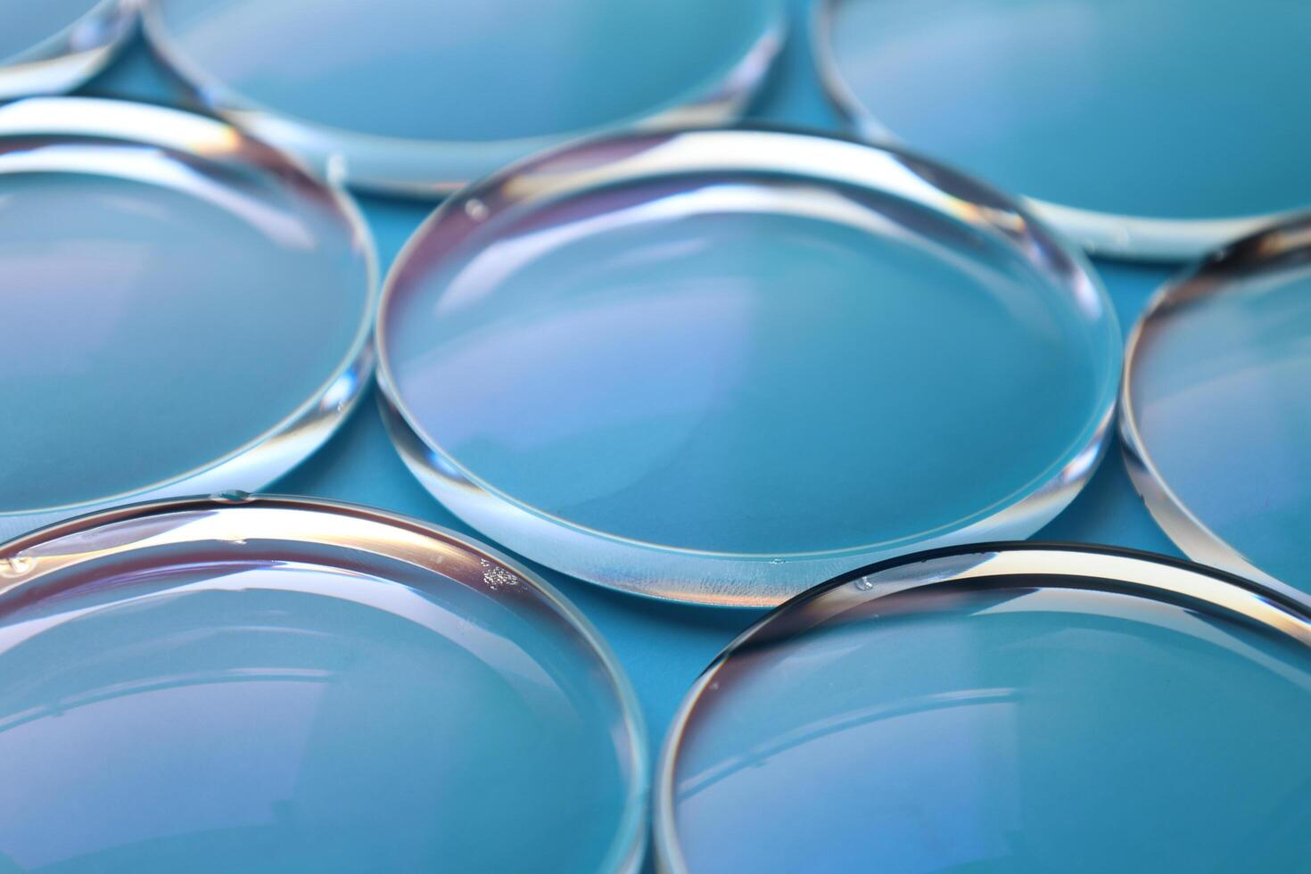 Eyeglasses lens production industry, close-up eyeglasses lenses, eyeglasses lenses, eyeglasses lenses, eyeglasses store business concept photo