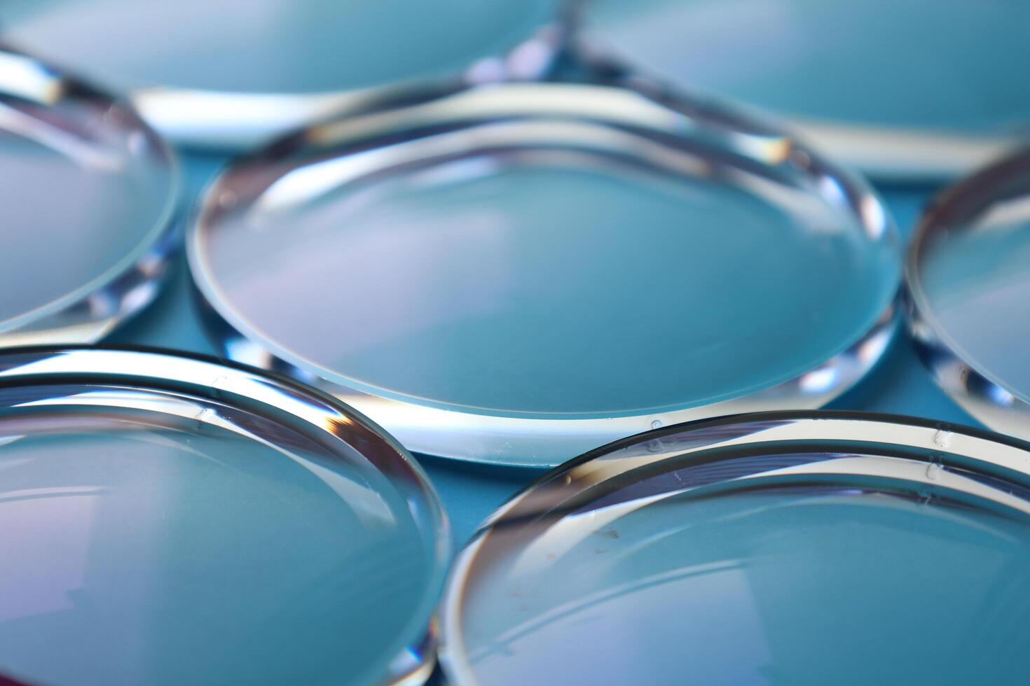 Eyeglasses lens production industry, close-up eyeglasses lenses, eyeglasses lenses, eyeglasses lenses, eyeglasses store business concept photo
