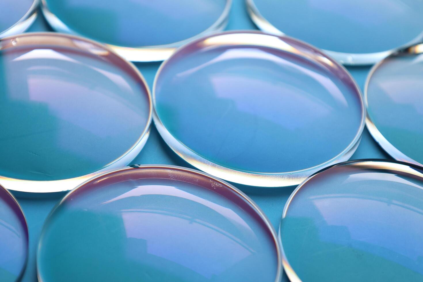 Eyeglasses lens production industry, close-up eyeglasses lenses, eyeglasses lenses, eyeglasses lenses, eyeglasses store business concept photo