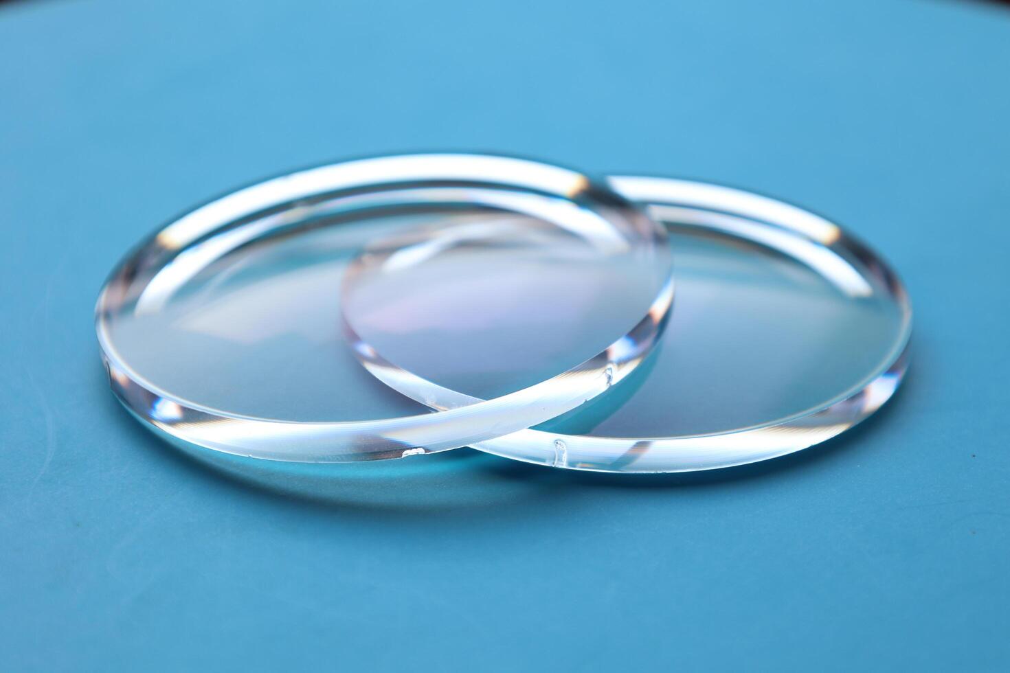 Eyeglasses lens production industry, close-up eyeglasses lenses, eyeglasses lenses, eyeglasses lenses, eyeglasses store business concept photo