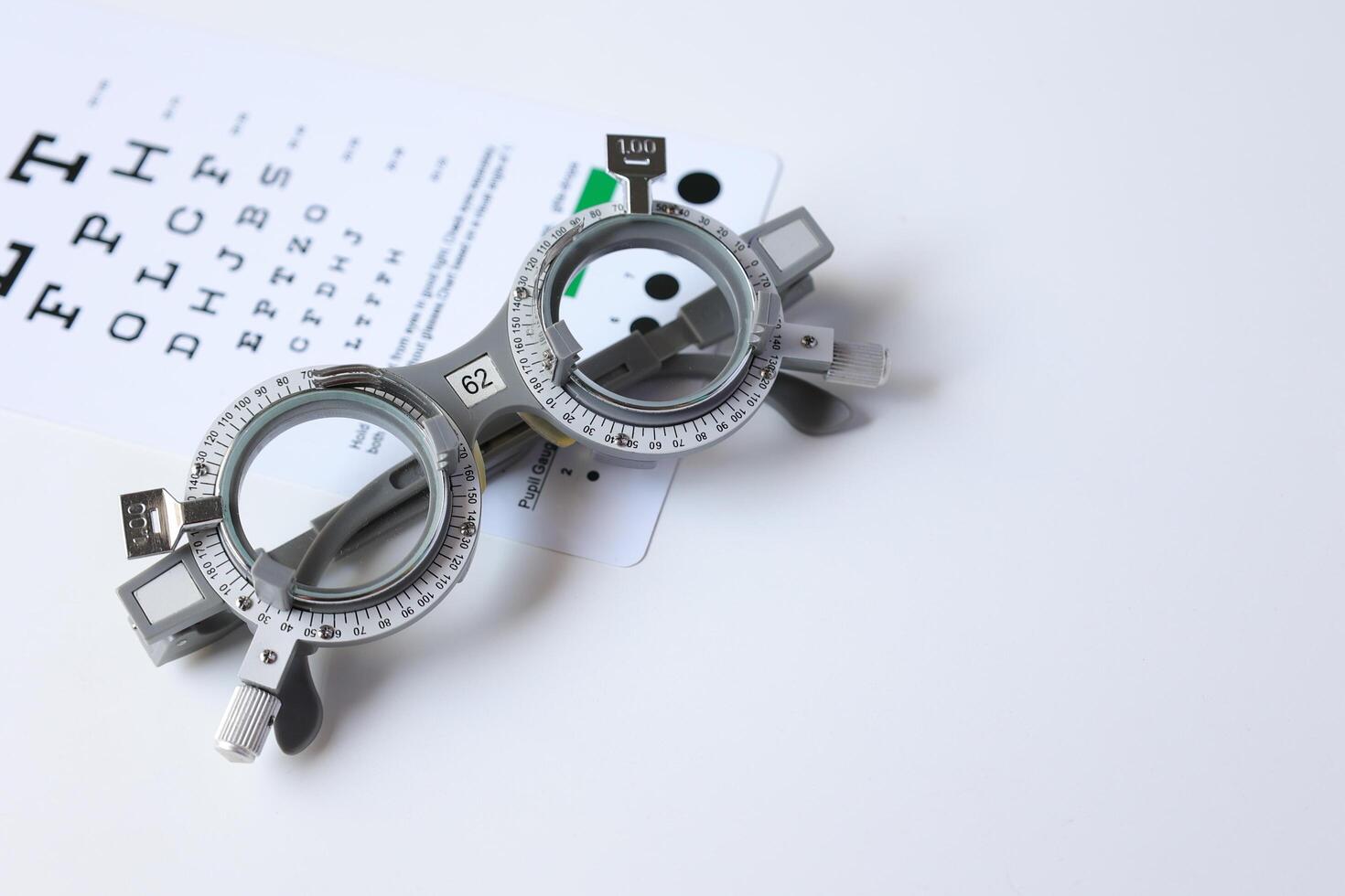 Glasses on chart in optical store photo