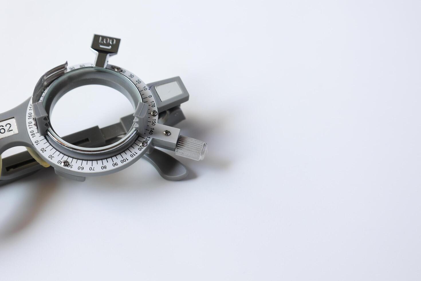 Trial frame glasses for eye test on chart in optical store photo